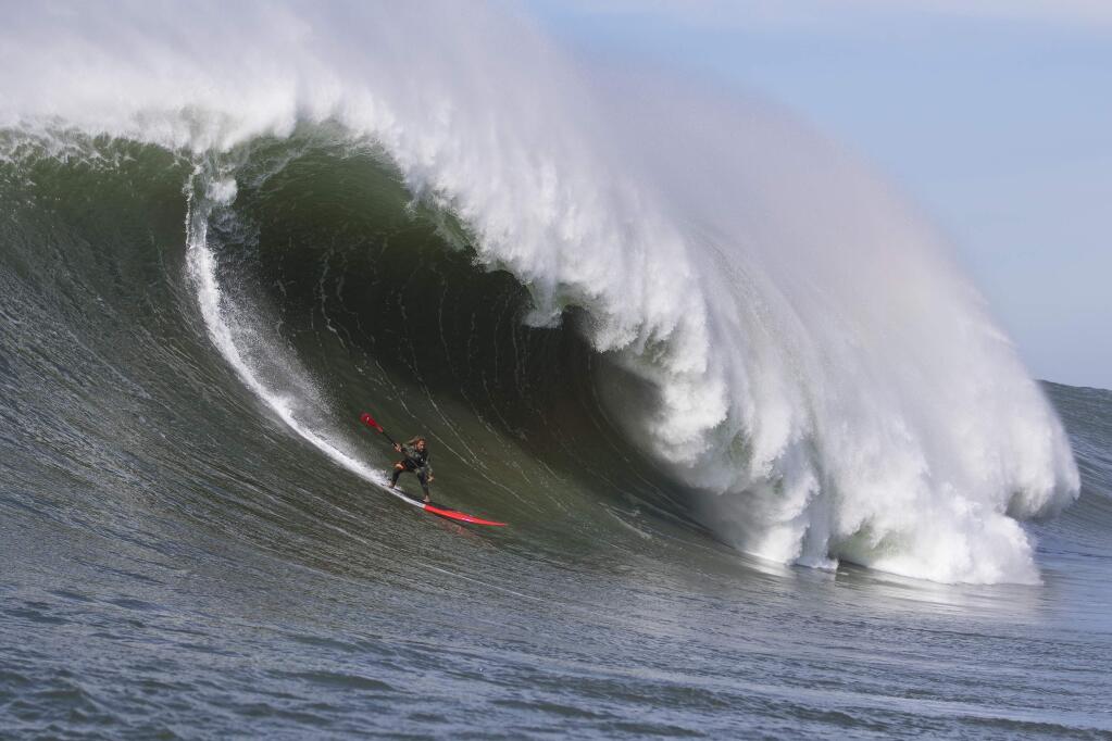 Kealii Mamala charges Mavericks on a stand-up paddle board photo by Frank Quirarte ©