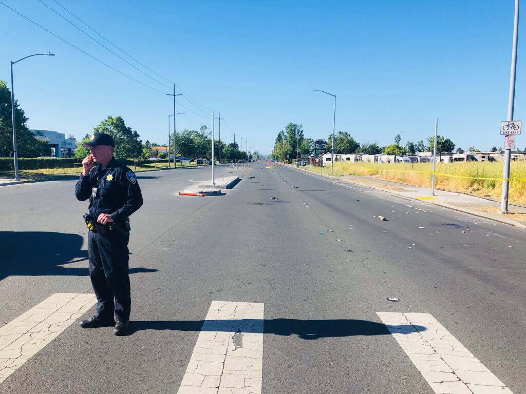 Santa Rosa police investigate a fatal alleged hit-and-run involving a suspected drunk driver and a pedestrian on Santa Rosa Avenue on Saturday, June 2, 2018. (JD Morris/The Press Democrat)