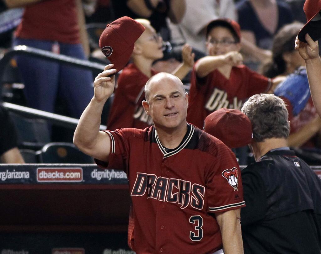 Arizona Diamondbacks manager Chip Hale salutes the fans for their support during the season during the middle of the sixth inning against the San Diego Padres, Sunday, Oct. 2, 2016, in Phoenix. (AP Photo/Ralph Freso)