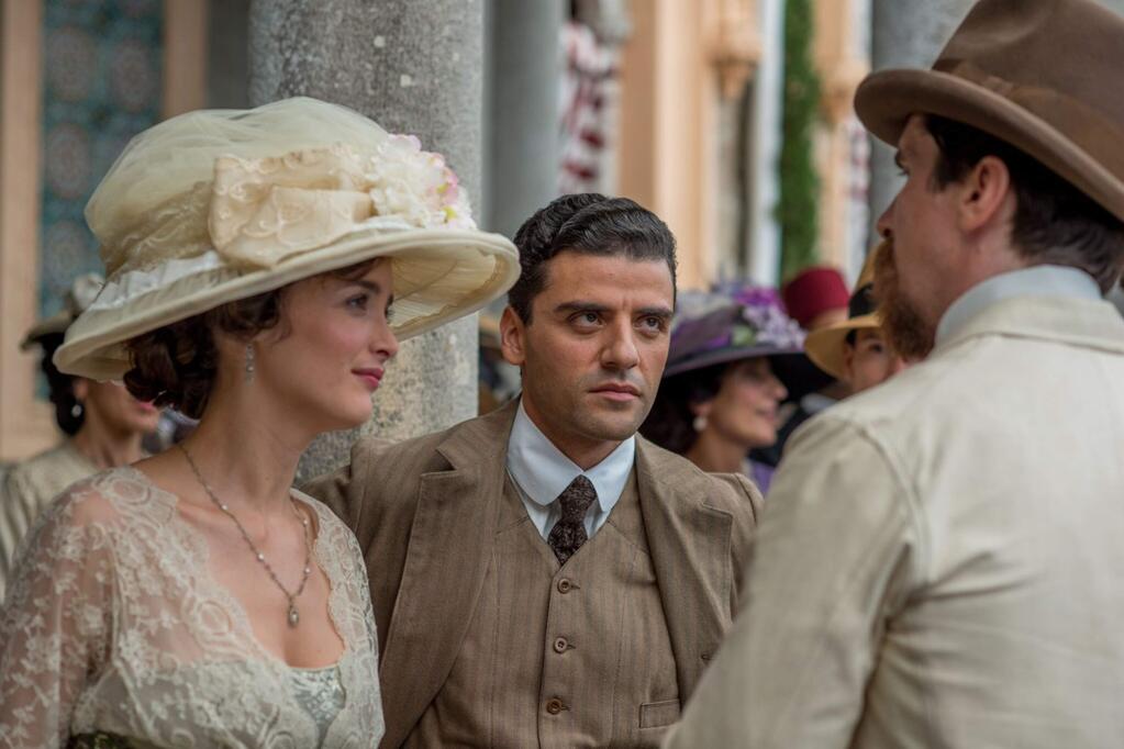 Charlotte Le Bon as Ana, Oscar Isaac as Michael and Christian Bale as Chris, star in 'The Promise,' a drama set against the war and brutal treatment of Armenians in the 1915 Ottoman Empire. (Open Road Films)