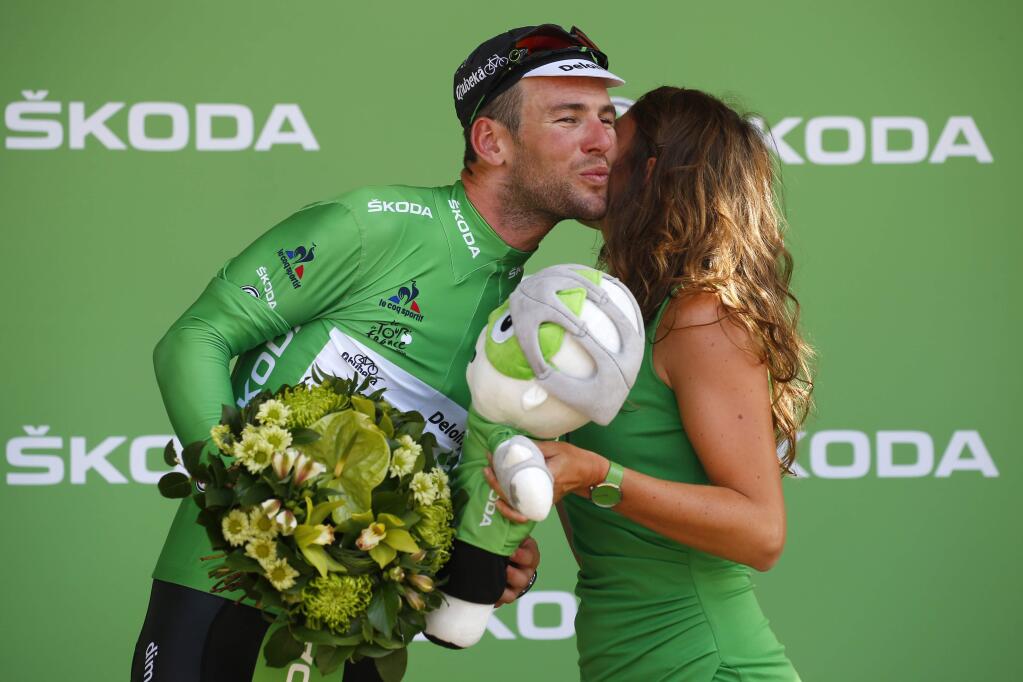 Stage winner Britain's Mark Cavendish, wearing the best sprinter's green jersey, celebrates on the podium after the sixth stage of the Tour de France cycling race over 190.5 kilometers (118.1 miles) with start in Arpajon-sur-Cere and finish in Montauban, France, Thursday, July 7, 2016. (AP Photo/Peter Dejong)