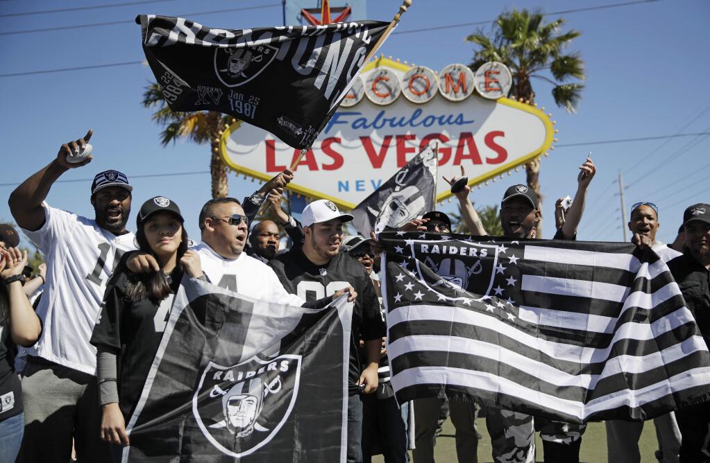 Fans cheer before the Oakland Raiders fourth round draft pick during an NFL football draft event Saturday, April 29, 2017, in Las Vegas. (AP Photo/John Locher)