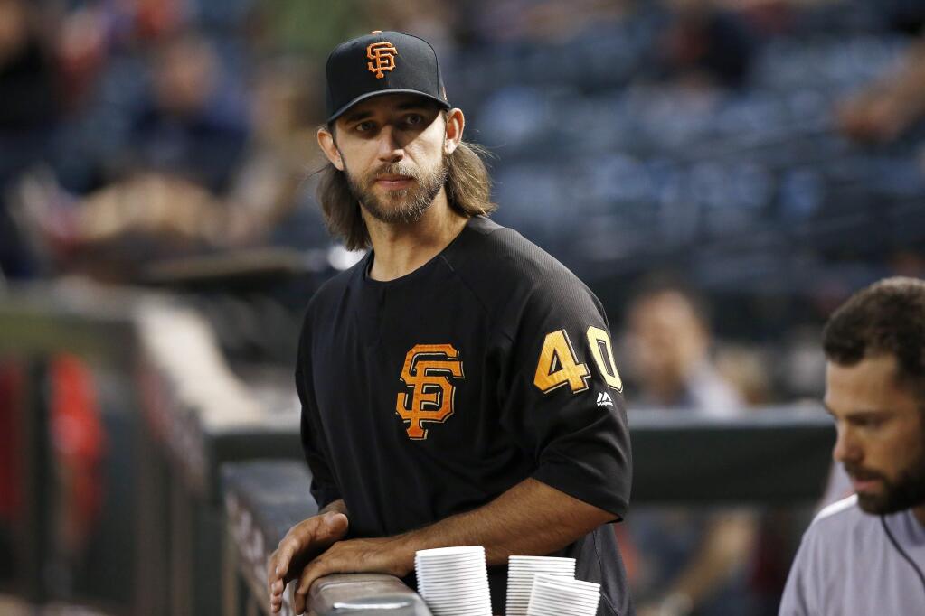 San Francisco Giants' Madison Bumgarner stands in the dugout prior to a baseball game against the Arizona Diamondbacks Wednesday, Sept. 27, 2017, in Phoenix. (AP Photo/Ross D. Franklin)