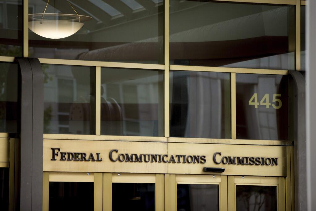 FILE - This June 19, 2015, file photo, shows the Federal Communications Commission building in Washington. Republicans in the House have followed the Senate in overturning an Obama-era broadband privacy regulation that set tough restrictions on what companies like Comcast, Verizon and AT&T could do with customers' personal information. It still needs President Donald Trump's signature. Consumer advocates and Democrats have slammed Republicans for gutting the Federal Communications Commission's regulation, saying it will leave Americans online unprotected; Republicans and industry groups counter that spiking the rule just maintains the status quo. (AP Photo/Andrew Harnik, File)
