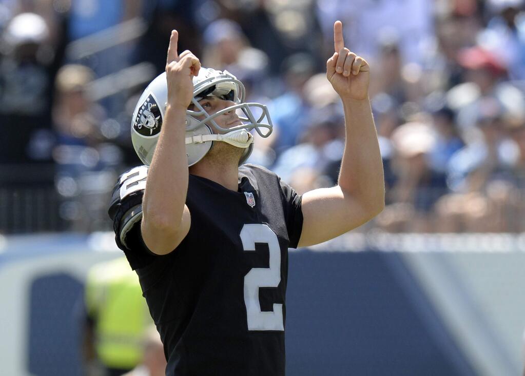 FILE - In this Sept. 10, 2017, file photo, Oakland Raiders kicker Giorgio Tavecchio celebrates after kicking a field goal against the Tennessee Titans in the first half of an NFL football game, in Nashville, Tenn. avecchio was close to giving up his dream of becoming an NFL kicker and take a job in London this offseason before deciding to give it one last shot with the Oakalnd Raiders. The move paid off when Tavecchio became the first kicker in NFL history to make two 50-yard field goals in his debut. (AP Photo/Mark Zaleski, File)