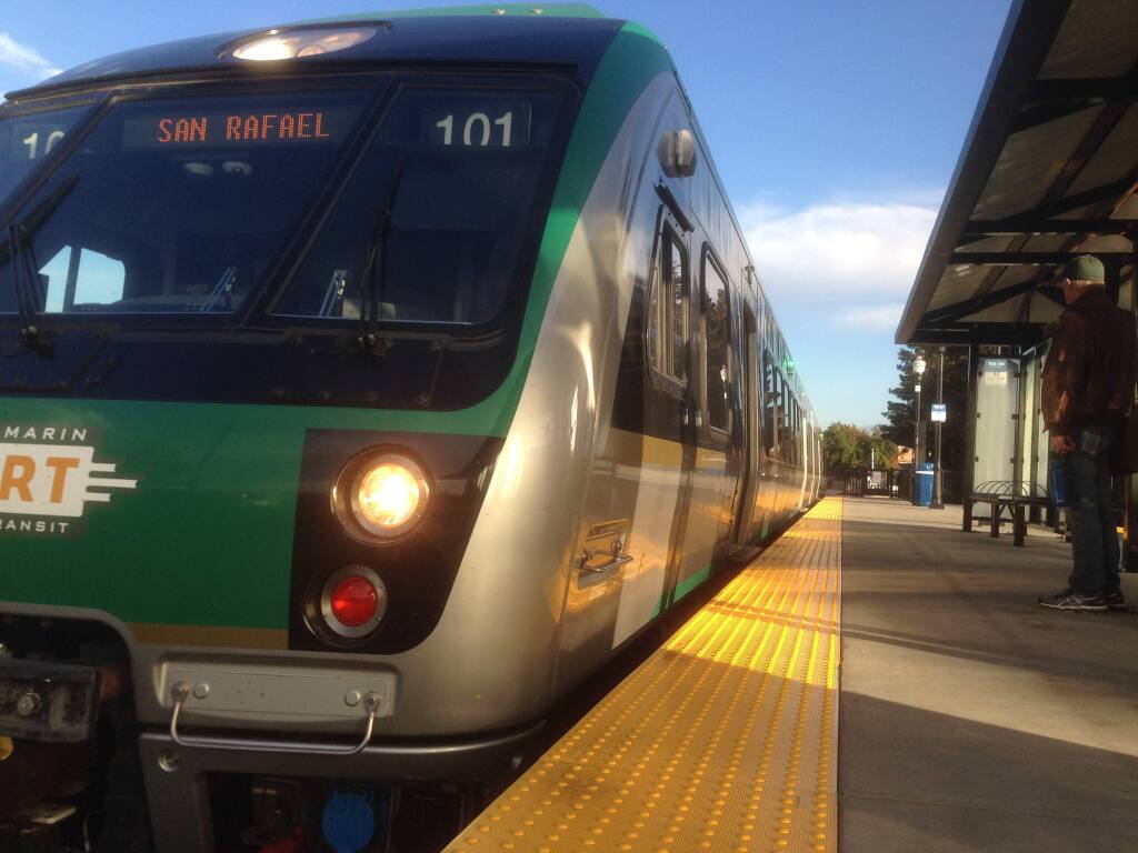 The new SMART train arriving at the downtown Santa Rosa station. The trains run on time, but schedules are shortened on weekends compared to weekdays. (Robert Digitale / The Press Democrat)
