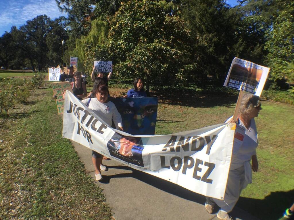 People marched from Santa Rosa Junior College to the Sonoma County Sheriff's Office on Friday, Oct. 21, 2016, to commemorate the third anniversary of the death of Andy Lopez. (JOHN BURGESS/ PD)