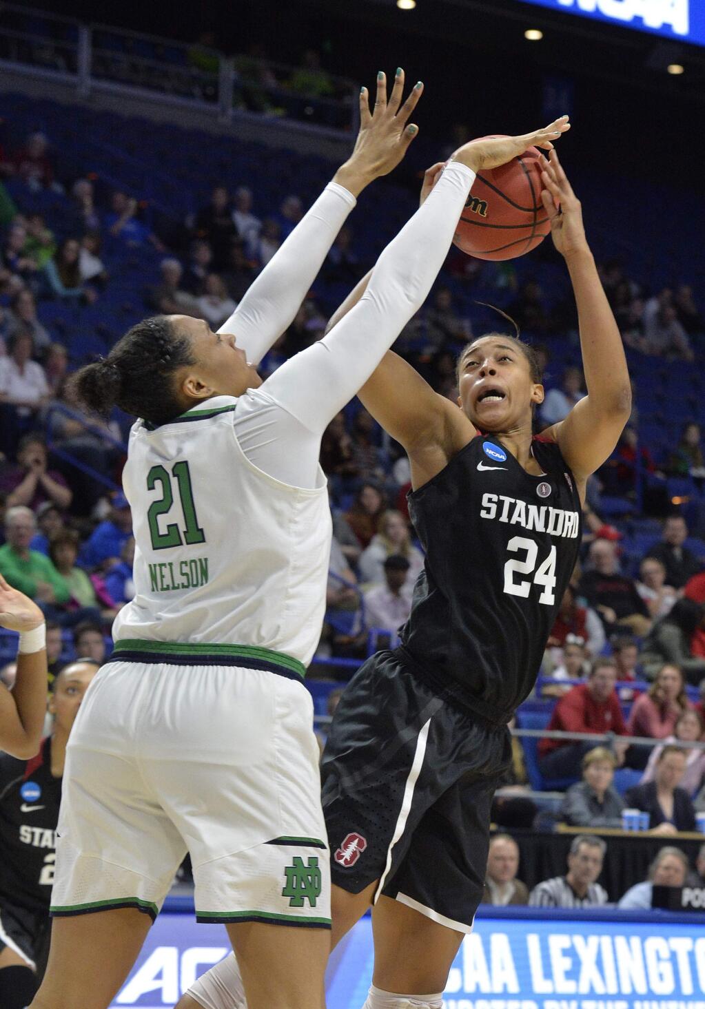 Notre Dame's Kristina Nelson (21) blocks the shot of Stanford's Erica McCall (24) during the first half of a regional final of the NCAA women's college basketball tournament, Sunday, March. 26, 2017, in Lexington, Ky. (AP Photo/Timothy D. Easley)