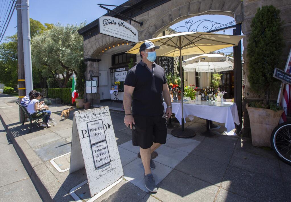 Rob Della Santina, proprietor of Della Santina's Trattoria, Rosticceria on East Napa Street, on the pavement in front of his restaurant where he hopes to soon be able to put tables for outdoor dining. (Photo by Robbi Pengelly/Index-Tribune)