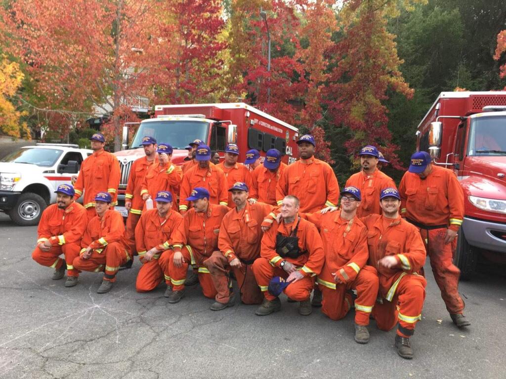 Santa Rosa residents whose homes were saved thank the inmate-firefighters with Washington Ridge Conservation Camp in Nevada County. (Chris Smith / Press Democrat)