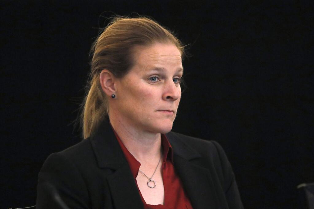 In this Dec. 6, 2019, file photo, Cindy Parlow Cone, vice president of the U.S. Soccer Federation, attends a meeting of the organization's board of directors Friday, Dec. 6, 2019, in Chicago. Carlos Cordeiro resigned as the federation's president March 12, 2020, three days after the organization sparked a backlash when its legal papers in a gender discrimination lawsuit claimed the women's national team players had less physical ability and responsibility than their male counterparts. His decision elevated former American midfielder Parlow Cone to become the first woman president in the history of the 107-year-old federation. (AP Photo/Charles Rex Arbogast, File)