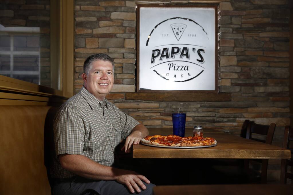 Mike Nixon, the owner of Papa's Pizza Cafe and an insurance agent, in Cloverdale on Tuesday, July 31, 2018. (Beth Schlanker/ The Press Democrat)