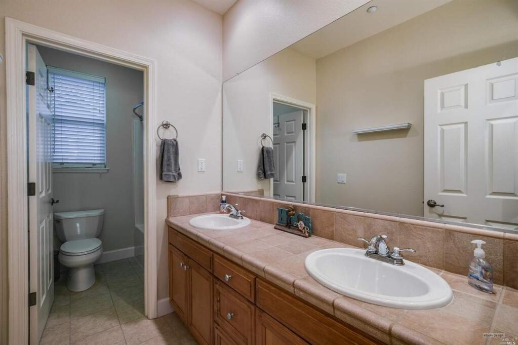 Double sinks and a private water closet in a bathroom at 1700 Southview Drive, Petaluma. Property listed by Rick Warner/ Bradley Real Estate, rickwarnerrealestate.com, 415-302-6348. (Courtesy of BAREIS)