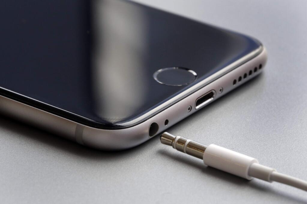 This Sept. 2, 2016, photo shows the earphone jack and charging port on an Apple iPhone 6, in New York. Apple is getting ready to unveil new iPhones on Wednesday, Sept. 7. With experts predicting few big changes from last year's models, speculation has focused on Apple's rumored decision to eliminate the iPhone's traditional headphone jack. It isn't clear what kind of hardware the company will promote instead, but the answer could be a hint at some of Apple's future plans. (AP Photo/Richard Drew)