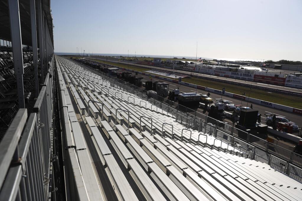The stands are empty overlooking the IndyCar Grand Prix of St. Petersburg, Fla., on Friday, March 13, 2020. Most racing events this year will be held before empty grandstands, including those at the Sonoma Raceway. (Dirk Shadd/Tampa Bay Times via AP)/Tampa Bay Times via AP)