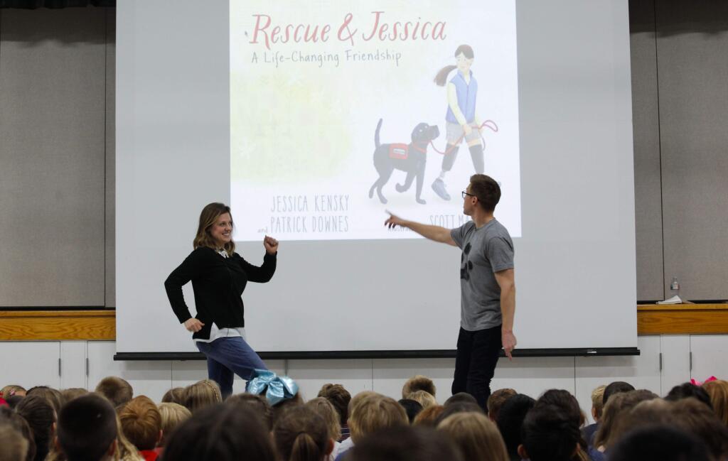 Jessica Krensky and her husband, Patrick Downes were victims of the Boston Marathon bombing. Jessica lost both legs and Patrick lost one. They wrote a children's book, 'Rescue & Jessica' about her service dog. They recently visited Sonoma Mountain Charter School to read from the book and meet kids. (CRISSY PASCUAL/ARGUS-COURIER STAFF)