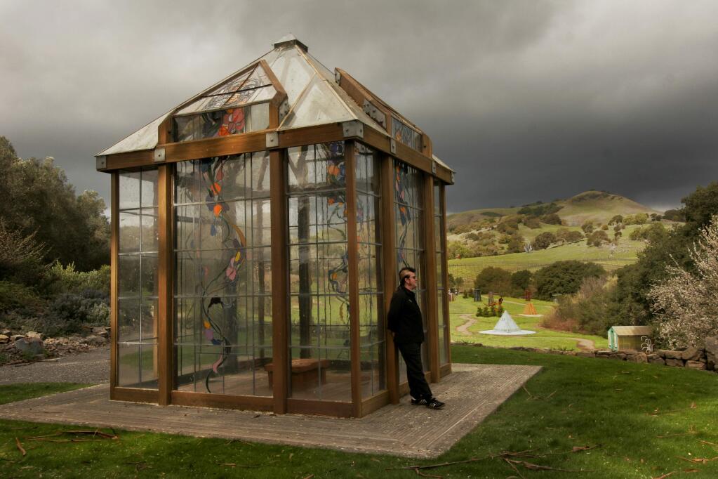 At the di Rosa Preserve, a creative oasis amid the grassy hills of the Carneros winegrowing region west of Napa, tour guide Paul 'Green' Greenwald stops at the wood,glass and metal gazebo overlooking the preserve's sculpture meadow. (PRESS DEMOCRAT/ MARK ARONOFF)