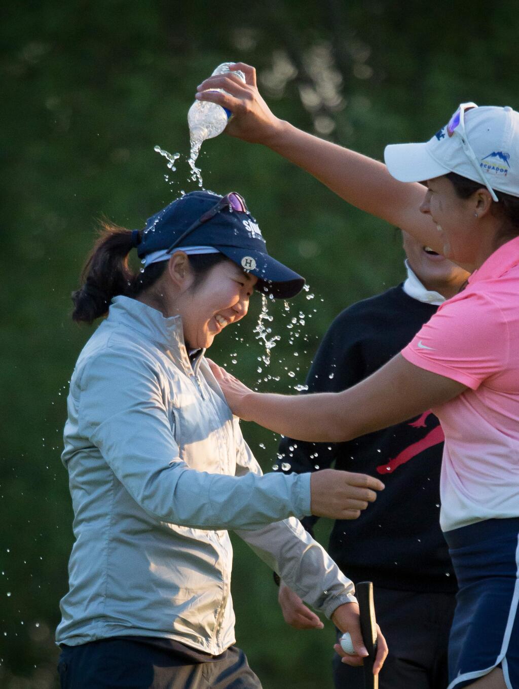 Hyemin Kim is drenched with water by Daniela Darquea after winning the final round of the LPGA's Symetra Tour stop at the Windsor Golf Club Sunday, April 9, 2017. Kim finished first with 7 under par.