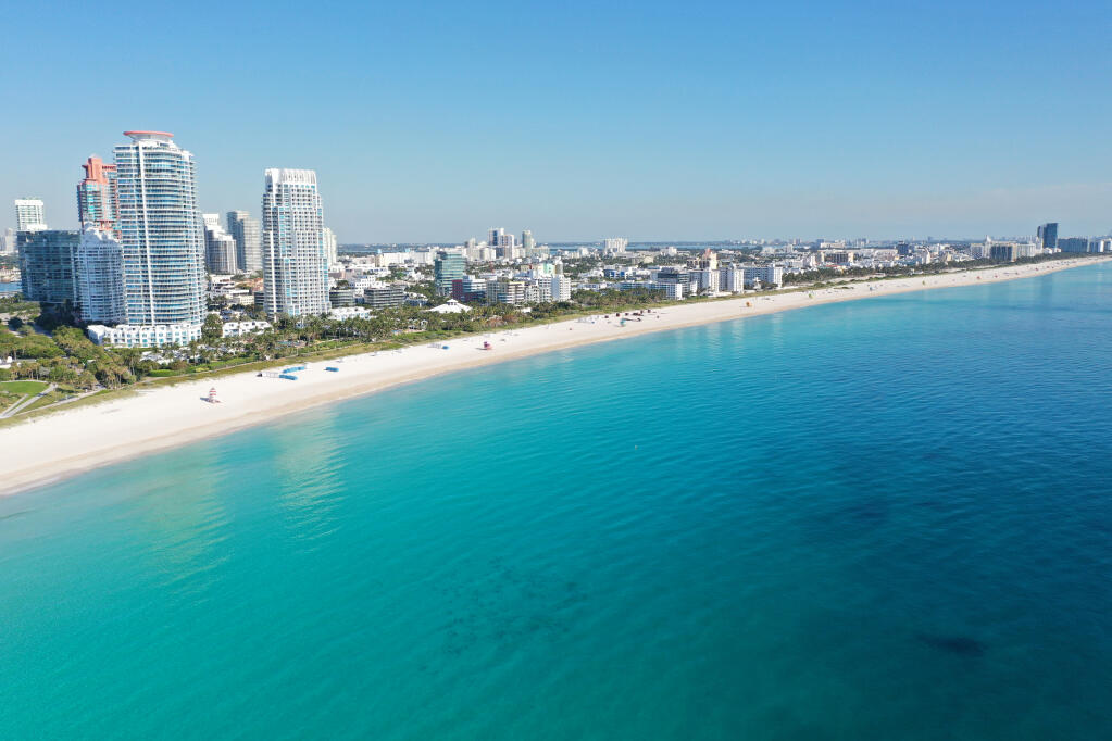 Aerial view of South Beach in Miami Beach, Florida devoid of people under coronavirus pandemic beach and park closure. (Francisco Blanco/Shutterstock.com)
