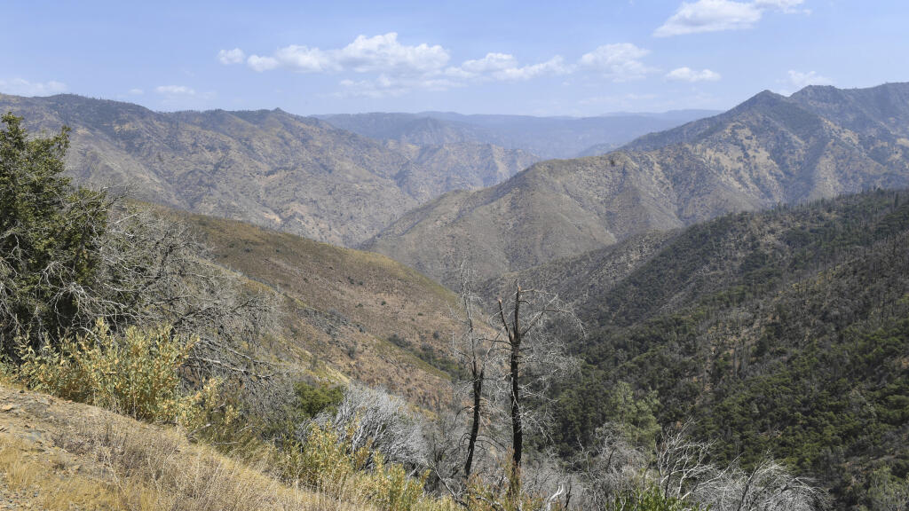 A remote canyon area northeast of the town of Mariposa, seen on Wednesday, Aug. 18, 2021, is reported to be the area where a family and their dog were found dead on Tuesday, the Mariposa County Sheriff's Office said.  (Craig Kohlruss/The Fresno Bee via AP)