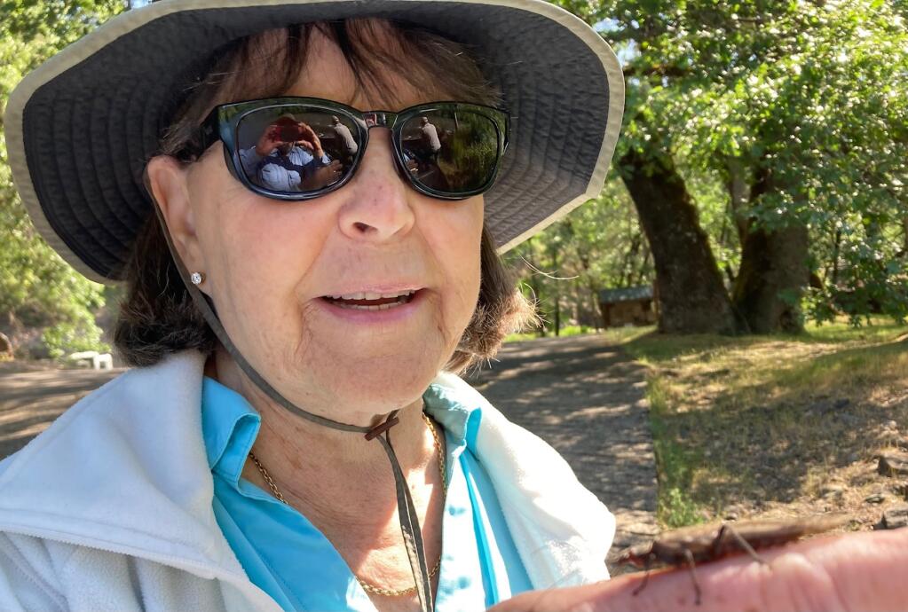 Big stone flies like this one that Dottie Lynch is holding were plentiful all around us and on and near the water. The trout didn’t seem interested. (Photo: Bill Lynch)