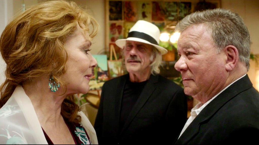 Jean Smart and William Shatner exchange a look while Christoper Lloyd looks on in the new film "Senior Moment," premiering locally at the SIFF Summerfest on Aug. 6, 2021, at Chateau St. Jean Winery. (Screen Media Films)