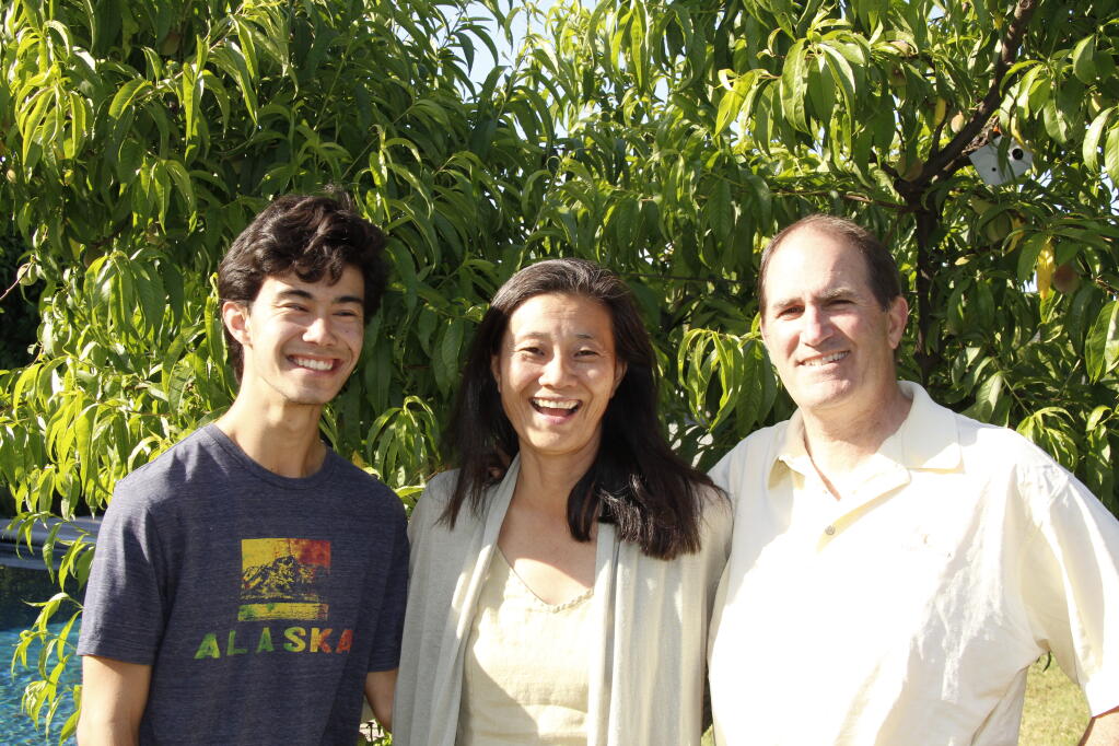 Gayle Okamura Sullivan with husband Brian and son Patrick at Dry Creek Peach and Produce. (Family photo)