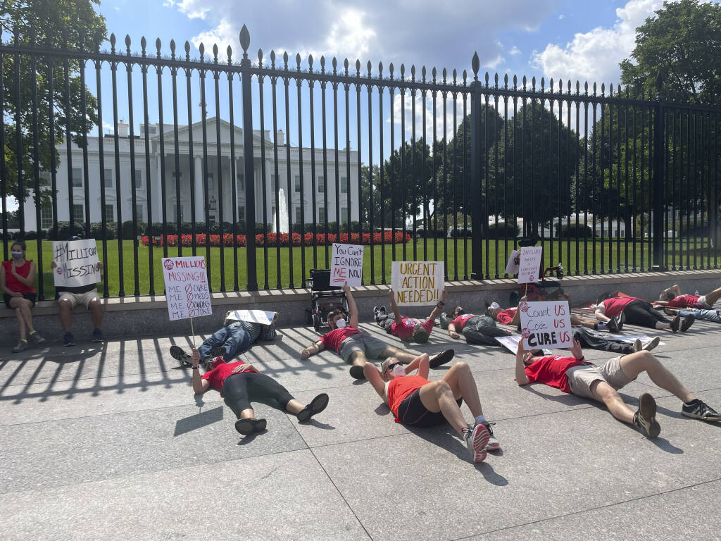 A protest demanding action on chronic fatigue syndrome and long COVID-19 in front of the White House, Washington, on Sept 19, 2022. Biden said the pandemic is over in an interview that aired on CBS’s “60 Minutes” on Sunday, Sept. 18, 2022; by Monday, the backlash was in full swing. (Zeynep Tufekci/The New York Times)