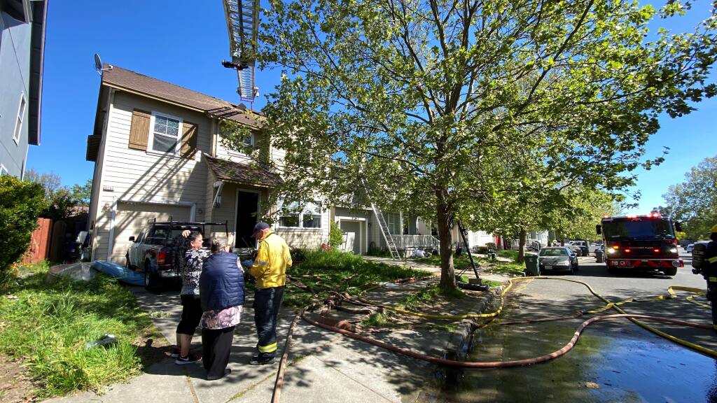 Santa Rosa and Sonoma County Fire District firefighters responded to a house fire in the 3200 block of Newmark Drive south of Santa Rosa on Thursday, April 20, 2023. (Kent Porter/The Press Democrat)