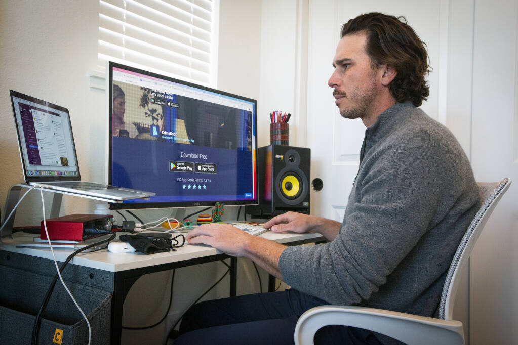 Ben Flajnik, who has worked on CrimeDoor, an app that allows users to enter true crime scenes, in his home office on March 3, 2021. (Robbi Pengelly/Index-Tribune)