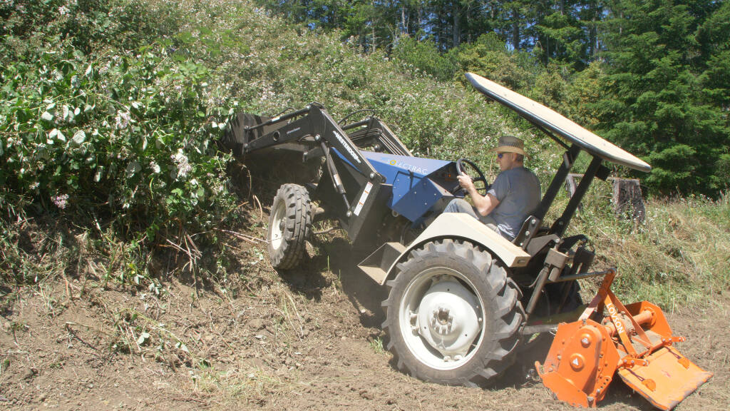 Solectrac founder Steve Heckeroth takes the eUtility tractor out he built for a spin.(courtesy photo)