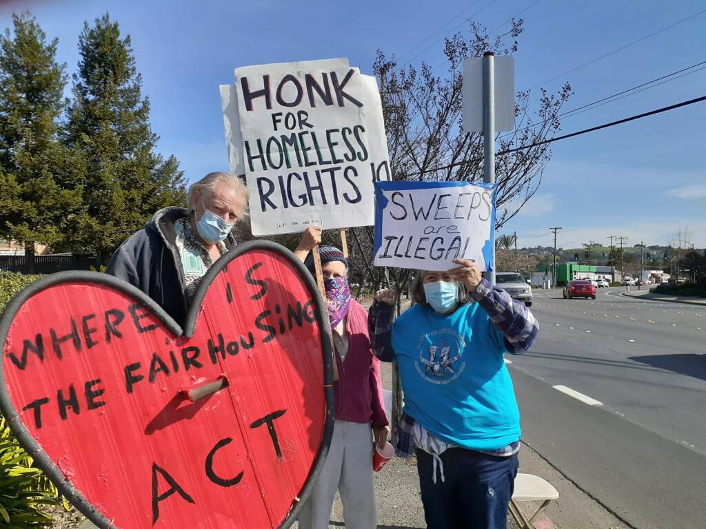 Kear Koch, Anita LaFollette, Victoria Yanez showed up to protest a homelessness sweep on March 2 in Santa Rosa. Photo courtesy Homeless Action.