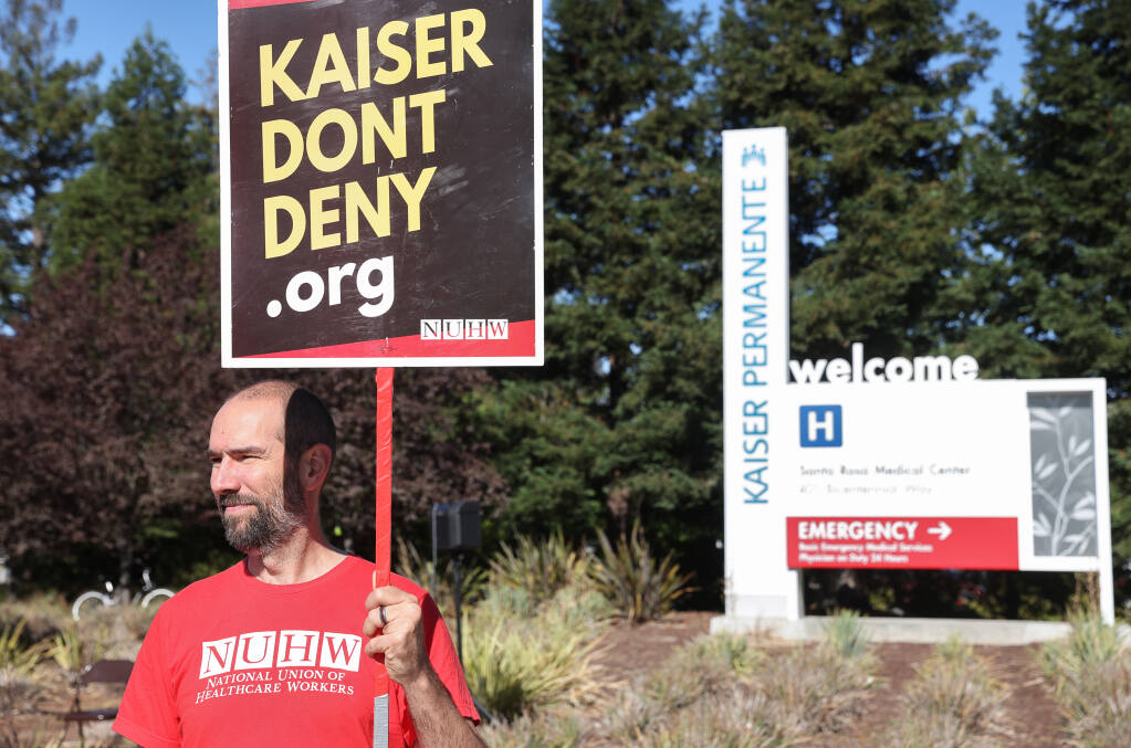 Mental health therapist George Bromley pickets with the National Union of Healthcare Workers in front of the Kaiser Permanente facility in Santa Rosa on Friday, Sept. 2, 2022.  (Christopher Chung/The Press Democrat FILE)