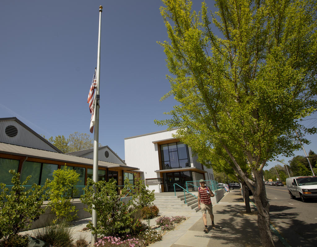 A Flag at half-staff at the Healdsburg City Hall in honor of the passing of former Police Chief Kevin Burke Wednesday April 6, 2022. (Chad Surmick / The Press Democrat)