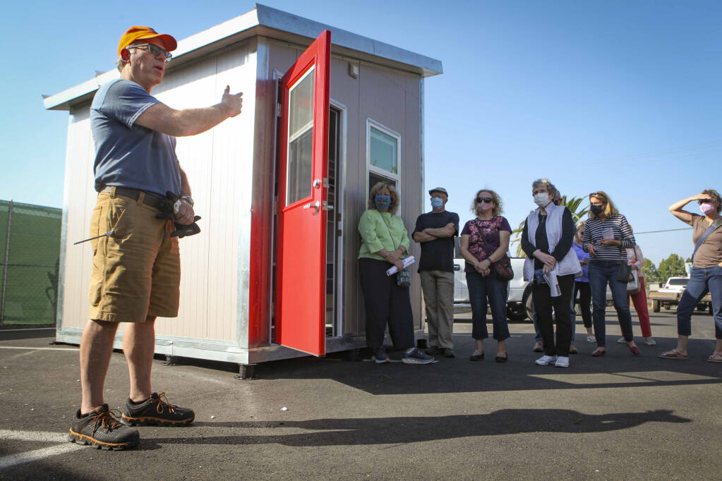 Dan Bodner of Rohnert Park-based QuickHaven Inc., demonstrates a tiny house he and his team constructed for the city of Petaluma and the nonprofit Committee on the Shelterless at the Mary Isaac Center on Friday, Sept. 17, 2021. They plan to build 25 of the transitional shelters on that property. (CRISSY PASCUAL/ARGUS-COURIER STAFF).