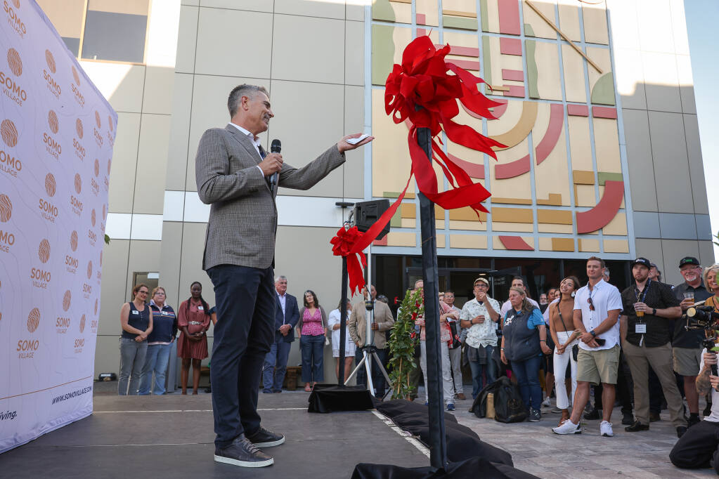 Brad Baker, founder and CEO of SOMO Living, addresses the crowd gathered for an open house and ribbon-cutting event at SOMO Village in Rohnert Park on Thursday, September 14, 2023.  (Christopher Chung/The Press Democrat)