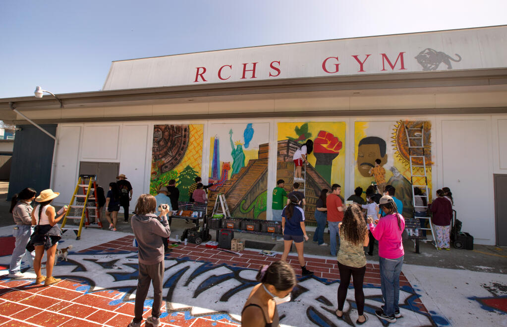 Students work on a mural in the main quad called "Native Us" at Rancho Cotate High School, Sunday, April 23, 2023, in Rohnert Park. (Darryl Bush / For The Press Democrat)