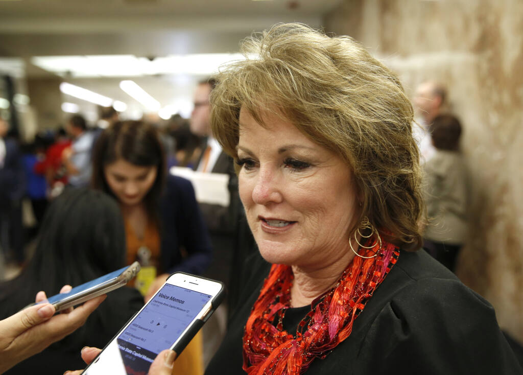 FILE - In this May 9, 2019, file photo, State Sen. Republican Leader Shannon Grove, of Bakersfield, talks to reporters in Sacramento, Calif. A labor consulting company led by Grove received a loan worth $150,000 to $350,000 from the Paycheck Protection Program, a national rescue package aimed to help small businesses during the pandemic, according to records released on Monday, July 6, 2020. Grove listed herself as president and CEO of Continental Labor Resources Inc. on most recent state public disclosure forms, reporting that she drew an income of over $100,000. The loan saved 365 jobs at the company, according to data. (AP Photo/Rich Pedroncelli, File)