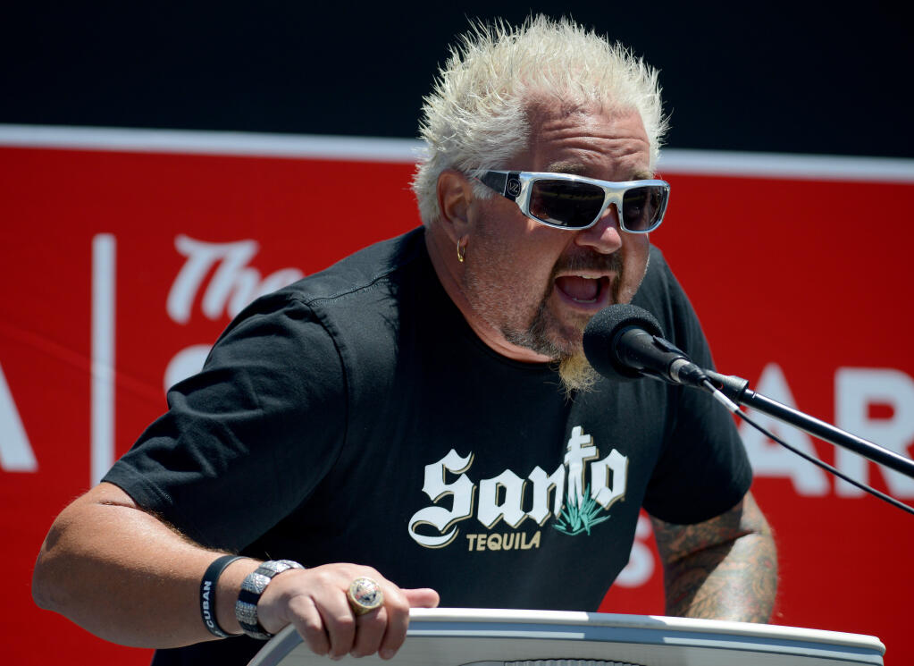 Chef and celebrity pace car driver Guy Fieri greets the audience before the Toyota/Save Mart 350 at Sonoma Raceway in Sonoma, Calif. on Sunday, June 6, 2021. (Alvin A.H. Jornada/For The Press Democrat)