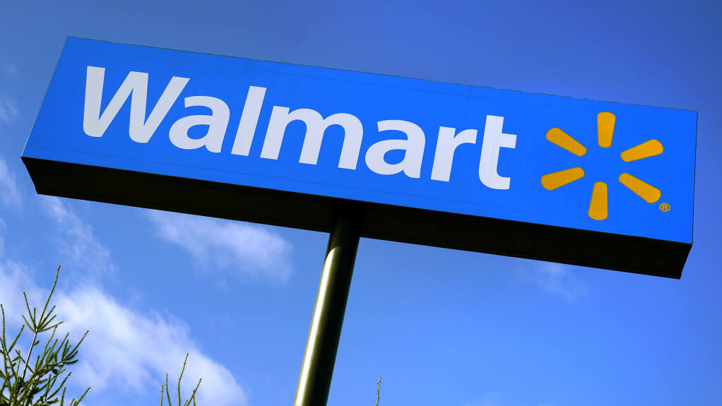 A Walmart store sign is visible on Nov. 18, 2020, in Derry, N.H. (AP Photo/Charles Krupa)