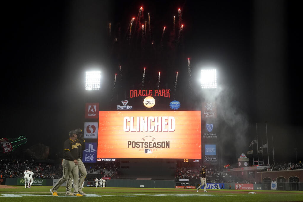 Fireworks go off behind the scoreboard at Oracle Park after the San Francisco Giants defeated the San Diego Padres in a baseball game to clinch a postseason berth in San Francisco, Monday, Sept. 13, 2021. (AP Photo/Jeff Chiu)