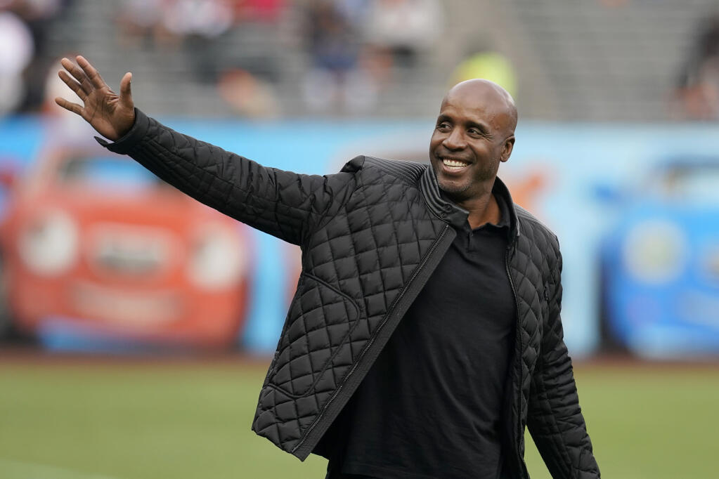 Former Giants player Barry Bonds waves as he arrives at a ceremony honoring Hunter Pence on the team's Wall of Fame before a game against the Dodgers Saturday, Sept. 17, 2022, in San Francisco. (Jeff Chiu / ASSOCIATED PRESS)