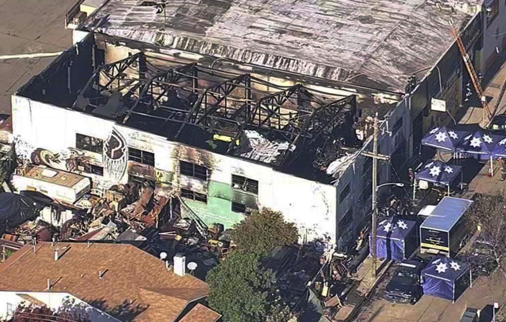 FILE - This Dec. 3, 2016, file image from video provided by KGO-TV shows the Ghost Ship Warehouse after a fire swept through the building in Oakland, Calif. A Northern California judge has barred lawyers from publicly discussing the case of two men each charged for their role with the warehouse illegally converted into an entertainment venue where a fire killed three dozen concert-goers. Judge Trina Thompson on Friday, Jan. 18, 2019, granted a prosecutors' request to silence the defendants' lawyers outside court. (KGO-TV via AP, File)