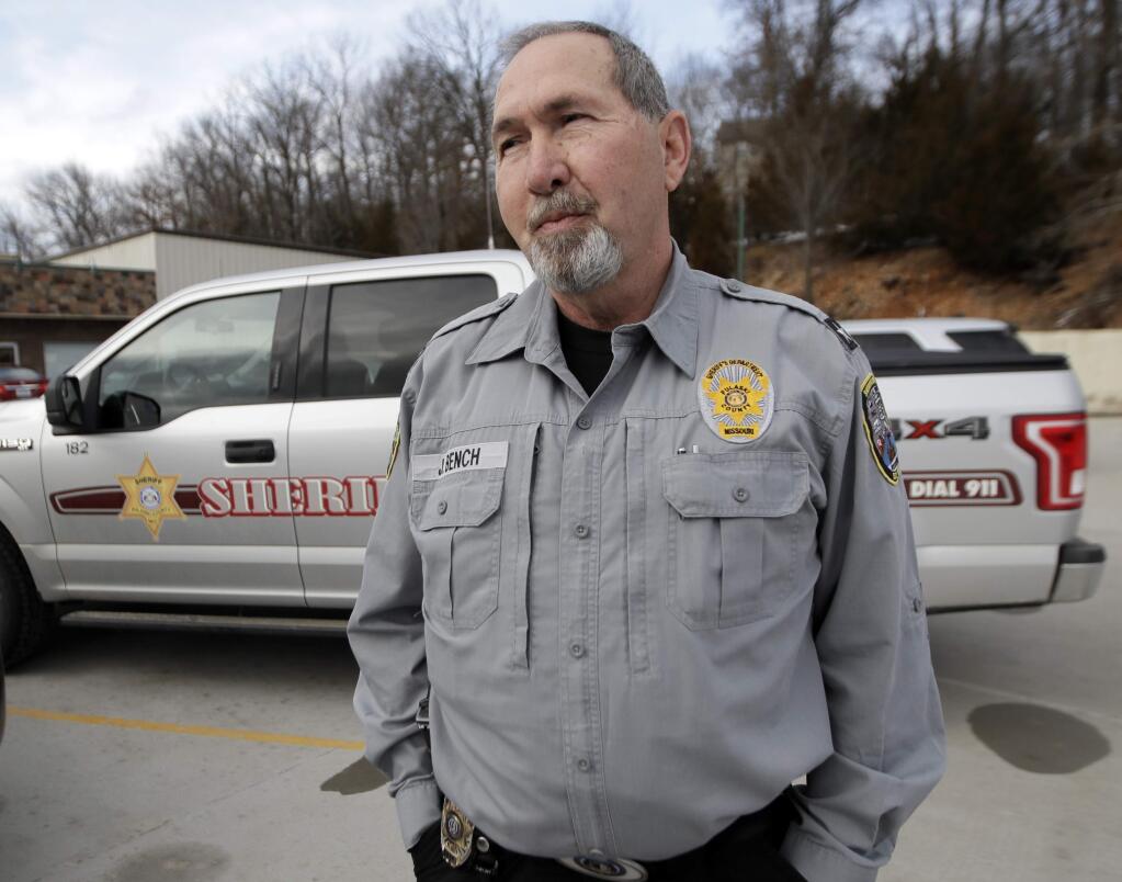 In this Feb. 20, 2019 photo, Pulaski County Sheriff Jimmy Bench stands outside city hall in Waynesville, Mo. For painful, personal reasons, Bench wishes the Daily Guide was there to report on the December death of his 31-year-old son, Ryan, due to a heroin overdose. It would have been better than dealing with whispers and Twitter. “Social media is so cruel sometimes,” Bench said. (AP Photo/Orlin Wagner)