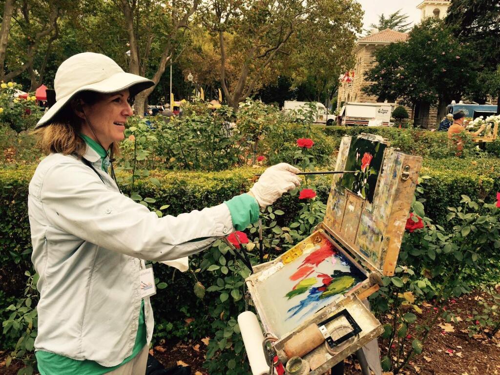 Photos by Robbi Pengelly/Index-TribuneJohn P. Lasater IV paints on First Street East. At Tuesday's Farmers Market and all over the Plaza, Plein Air artists, who have been painting throughout the county during the week, will be given 90 minutes to complete a artwork.