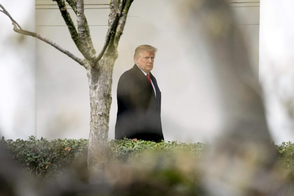 President Donald Trump walks along the Colonnade to greet Australian Prime Minister Malcolm Turnbull and his wife Lucy Turnbull as they arrive at the White House in Washington, Friday, Feb. 23, 2018. (AP Photo/Andrew Harnik)