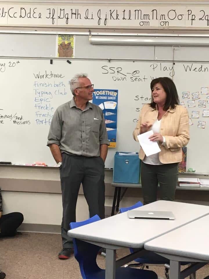 Mike Watt, Excellence in Education award winner, with Maureen Highland, executive director of the Petaluma Educational Foundation.