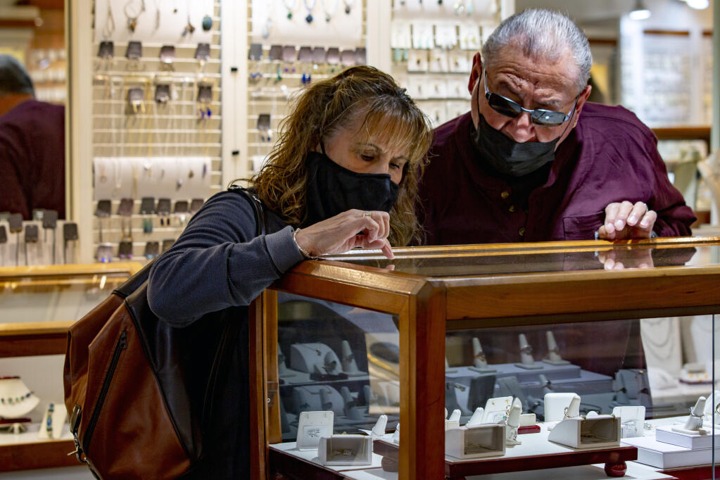 Doris and Hector Garcia stop into Halem & Co. jewelry store on First Street East for some shopping on Black Friday, Nov. 26, 2021. (Photo by Robbi Pengelly/Index-Tribune)