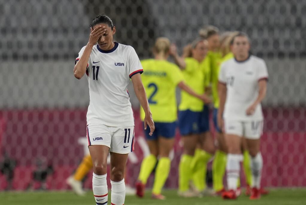 The United States’ Christen Press reacts as Sweden’s players celebrate their third goal during a game at the Olympics on Wednesday, July 21, 2021, in Tokyo. (Ricardo Mazalan / ASSOCIATED PRESS)