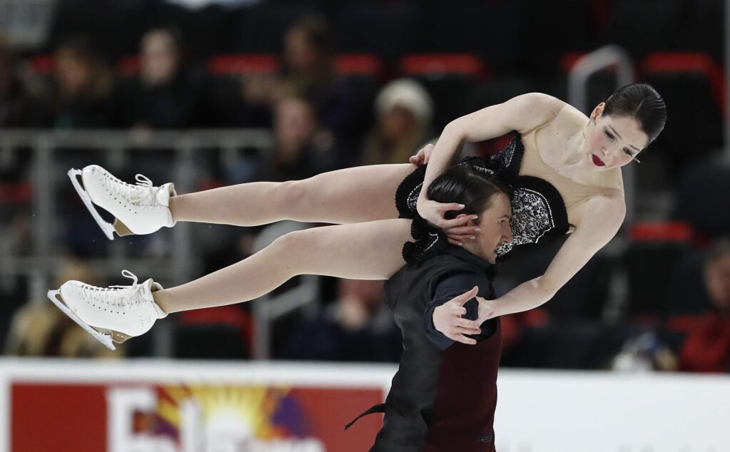 Lorraine McNamara and Quinn Carpenter perform in the rhythm dance program during the U.S. Figure Skating Championships, Friday, Jan. 25, 2019, in Detroit. (AP Photo/Carlos Osorio)